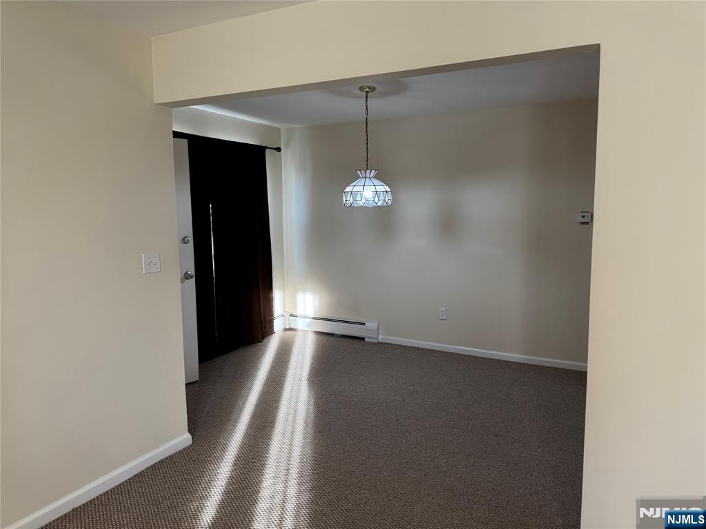 101 Halstead Avenue Wallington, NJ 07057 - Photo 5 of 11 an empty room with wooden floor and windows