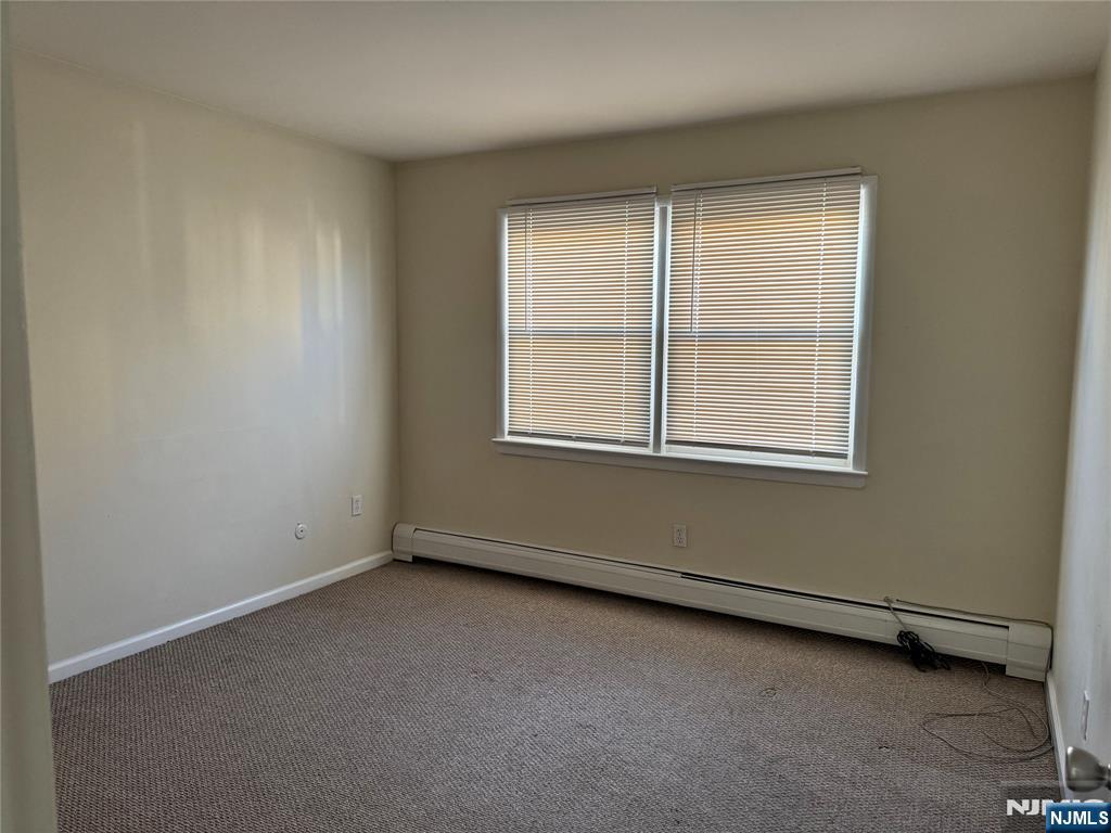 101 Halstead Avenue Wallington, NJ 07057 - Photo 7 of 11 an empty room with a window
