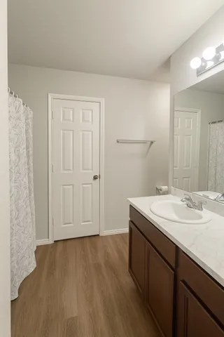 a view of a dining room with wooden floor