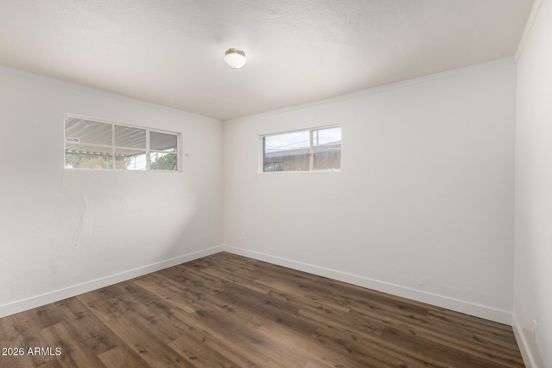 2114 West Rancho Drive Phoenix, AZ 85015 - Photo 15 of 29 wooden floor in an empty room