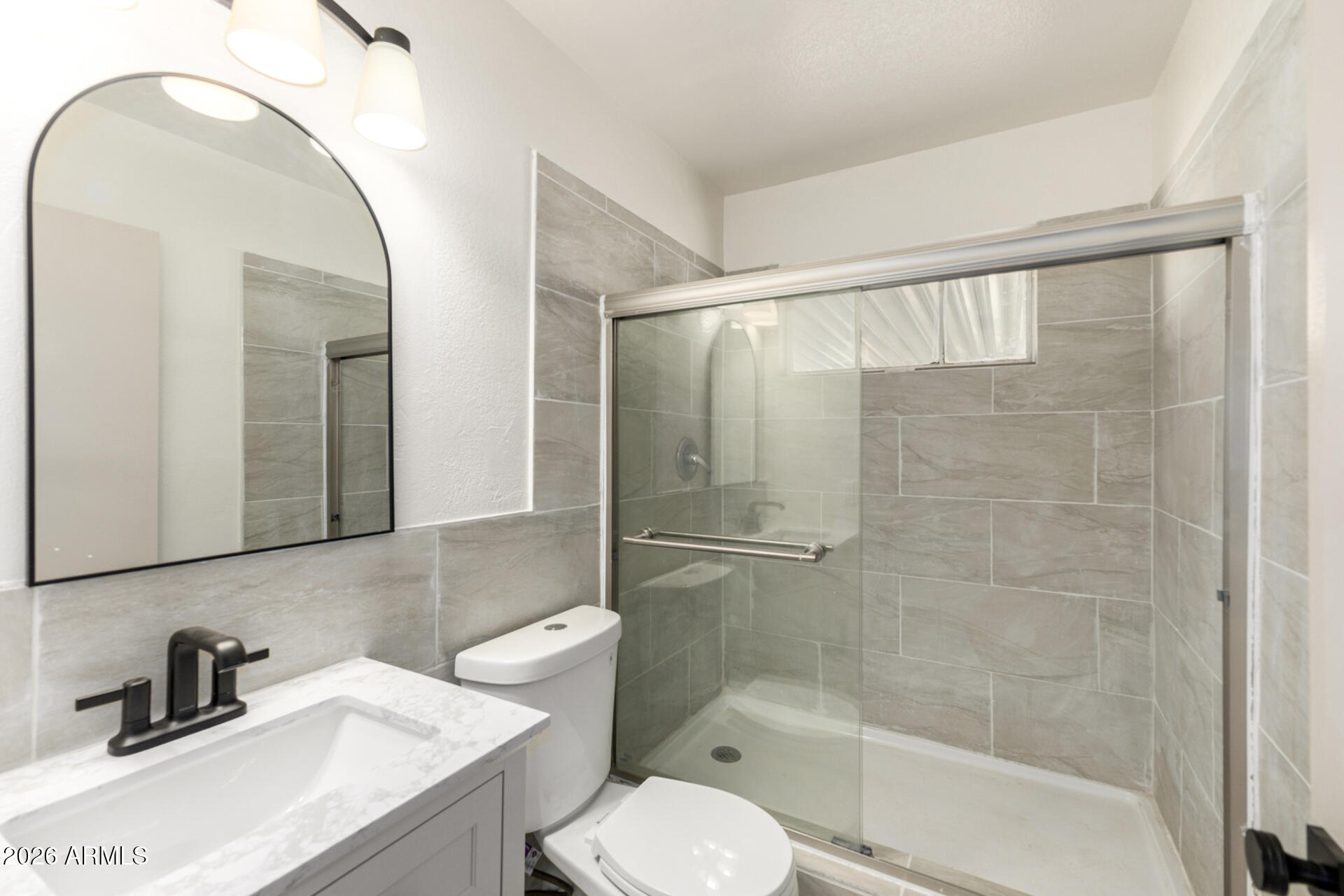 2114 West Rancho Drive Phoenix, AZ 85015 - Photo 21 of 29 a bathroom with a sink a toilet and shower