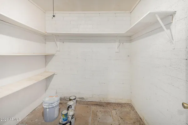 a view of a storage & utility room with a sink