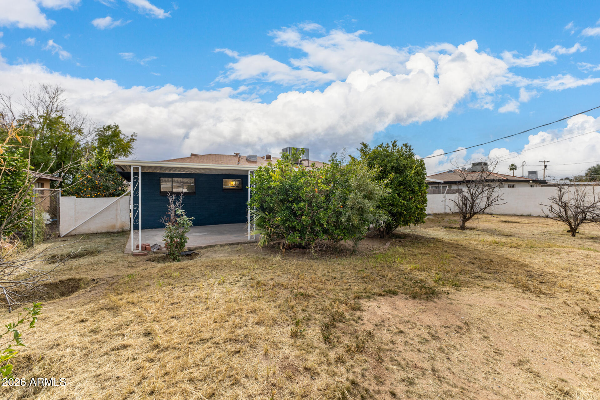 2114 West Rancho Drive Phoenix, AZ 85015 - Photo 27 of 29 a view of a house with backyard and sitting area