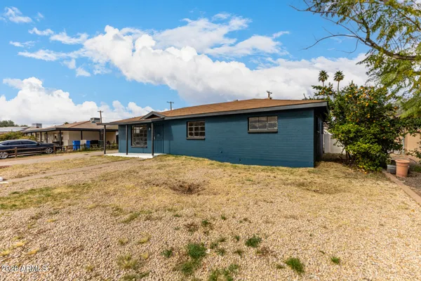 a house view with a backyard