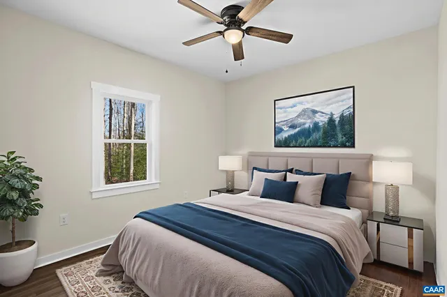 a bedroom with a large bed and a potted plant