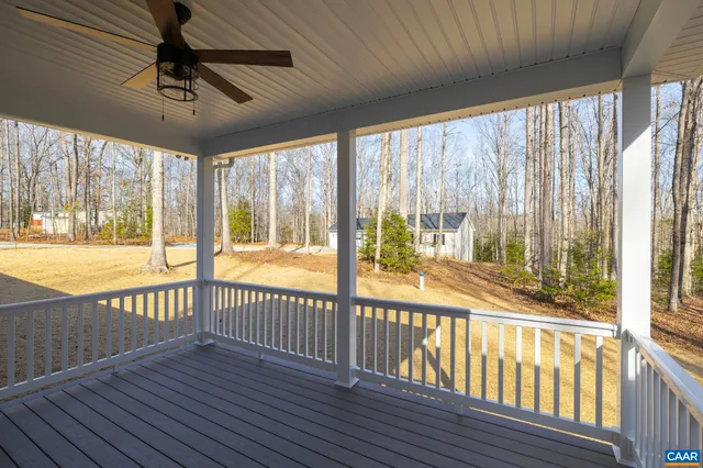 a view of a porch with wooden floor and outdoor space