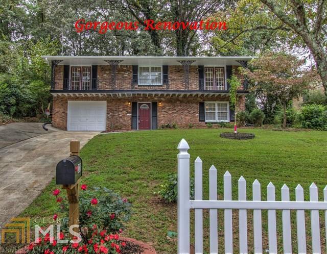 2727 Sherlock Drive, Unit 28 Decatur, GA 30034 - Photo 1 of 1 a front view of a house with a garden