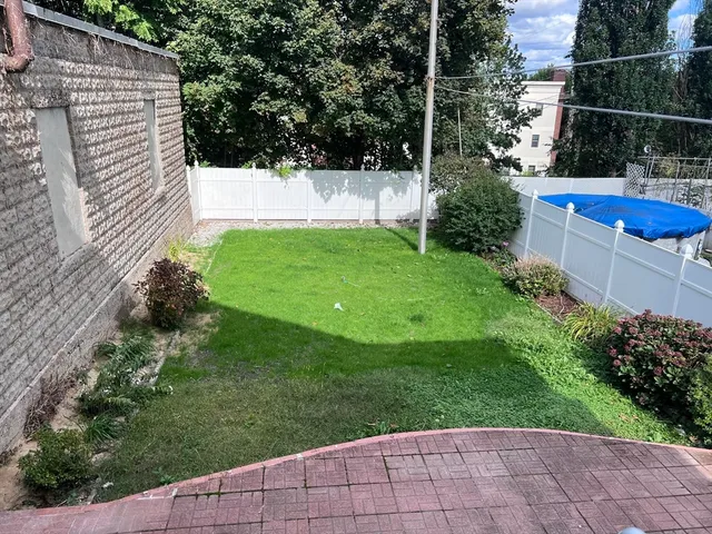 a view of yard with a tub