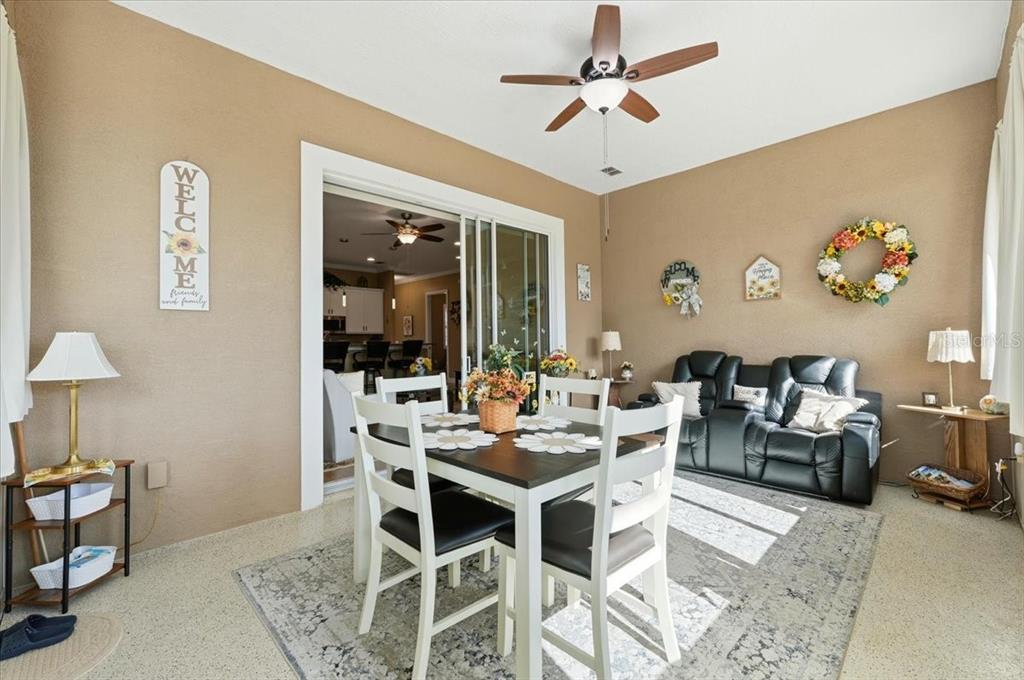 708 Teaberry Trail Polk City, FL 33868 - Photo 24 of 46 a view of a dining room with furniture
