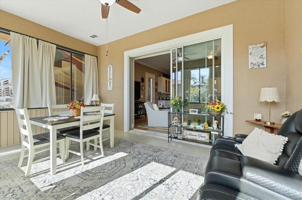 708 Teaberry Trail Polk City, FL 33868 - Photo 25 of 46 a view of a livingroom with furniture and a table