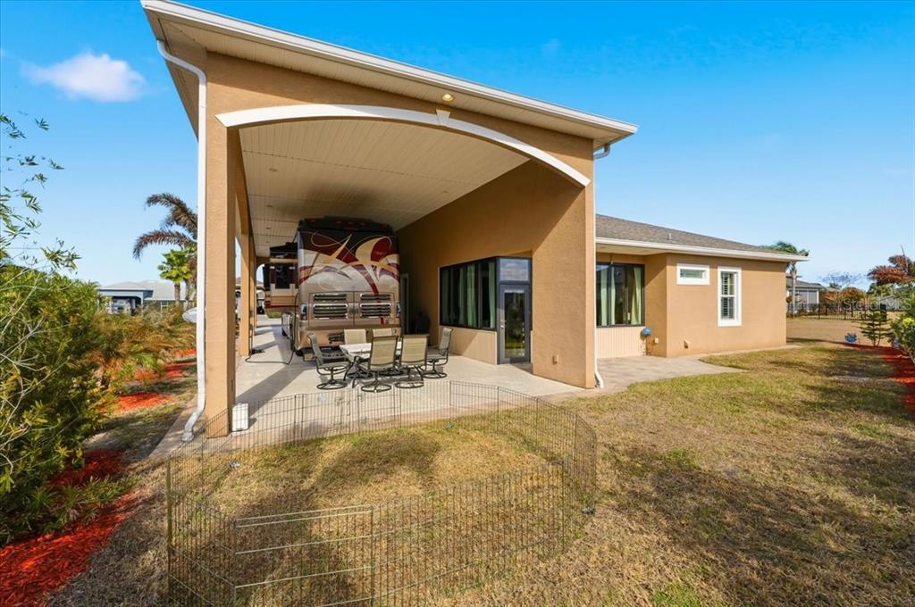 708 Teaberry Trail Polk City, FL 33868 - Photo 4 of 46 a view of a house with backyard porch and sitting area