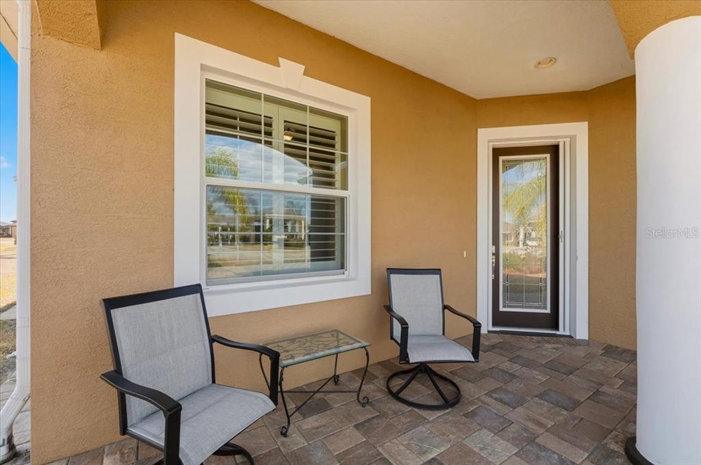 708 Teaberry Trail Polk City, FL 33868 - Photo 41 of 46 a living room with furniture and a window