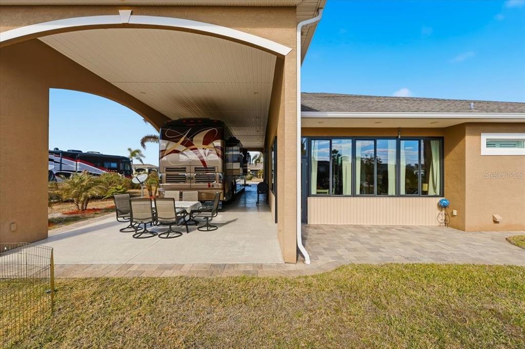 708 Teaberry Trail Polk City, FL 33868 - Photo 6 of 46 a view of garage with view of living room