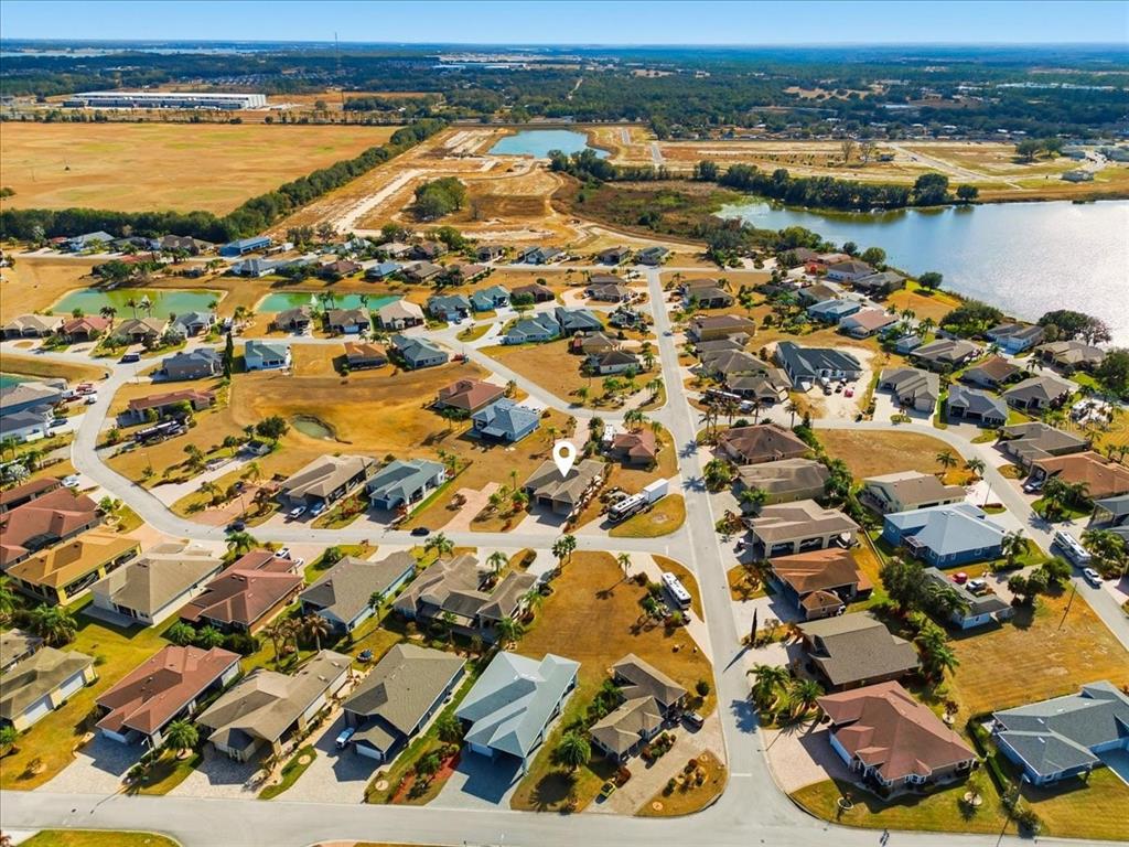 708 Teaberry Trail Polk City, FL 33868 - Photo 7 of 46 an aerial view of residential building and lake view
