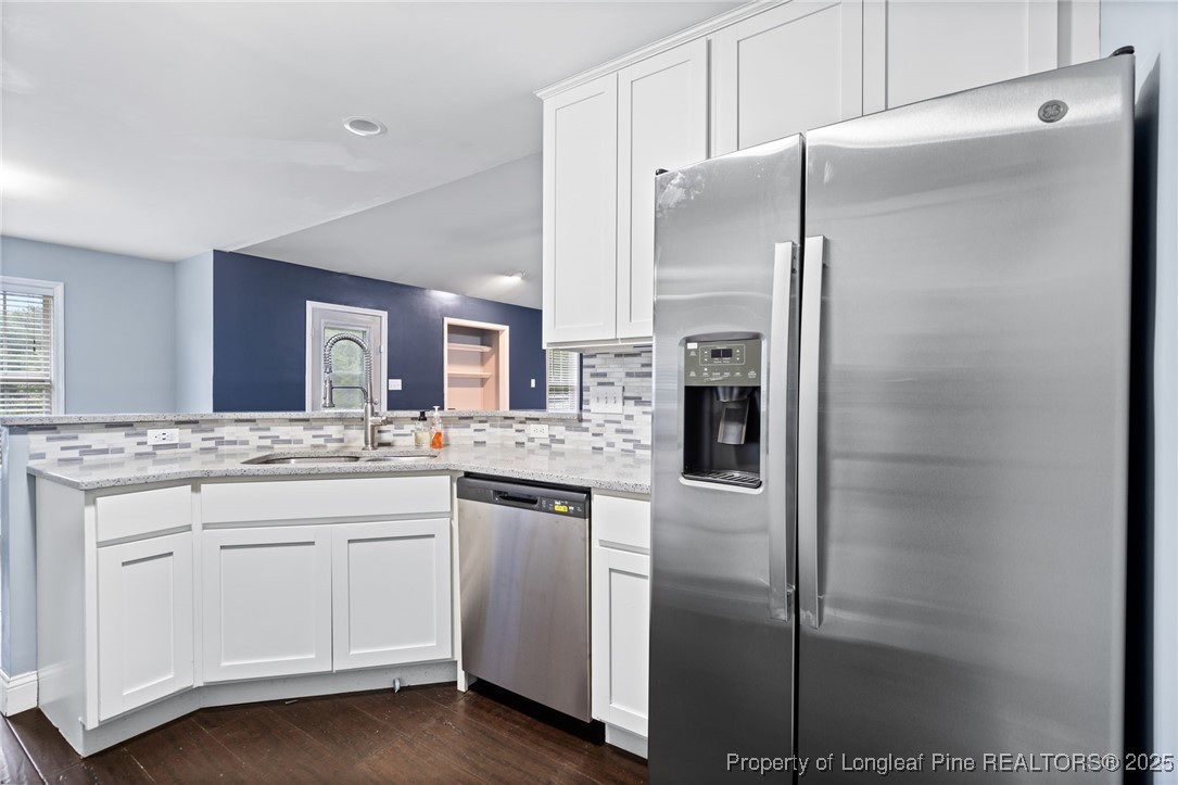 4225 Redmill Lane Hope Mills, NC 28348 - Photo 29 of 40 a kitchen with stainless steel appliances a refrigerator and a sink