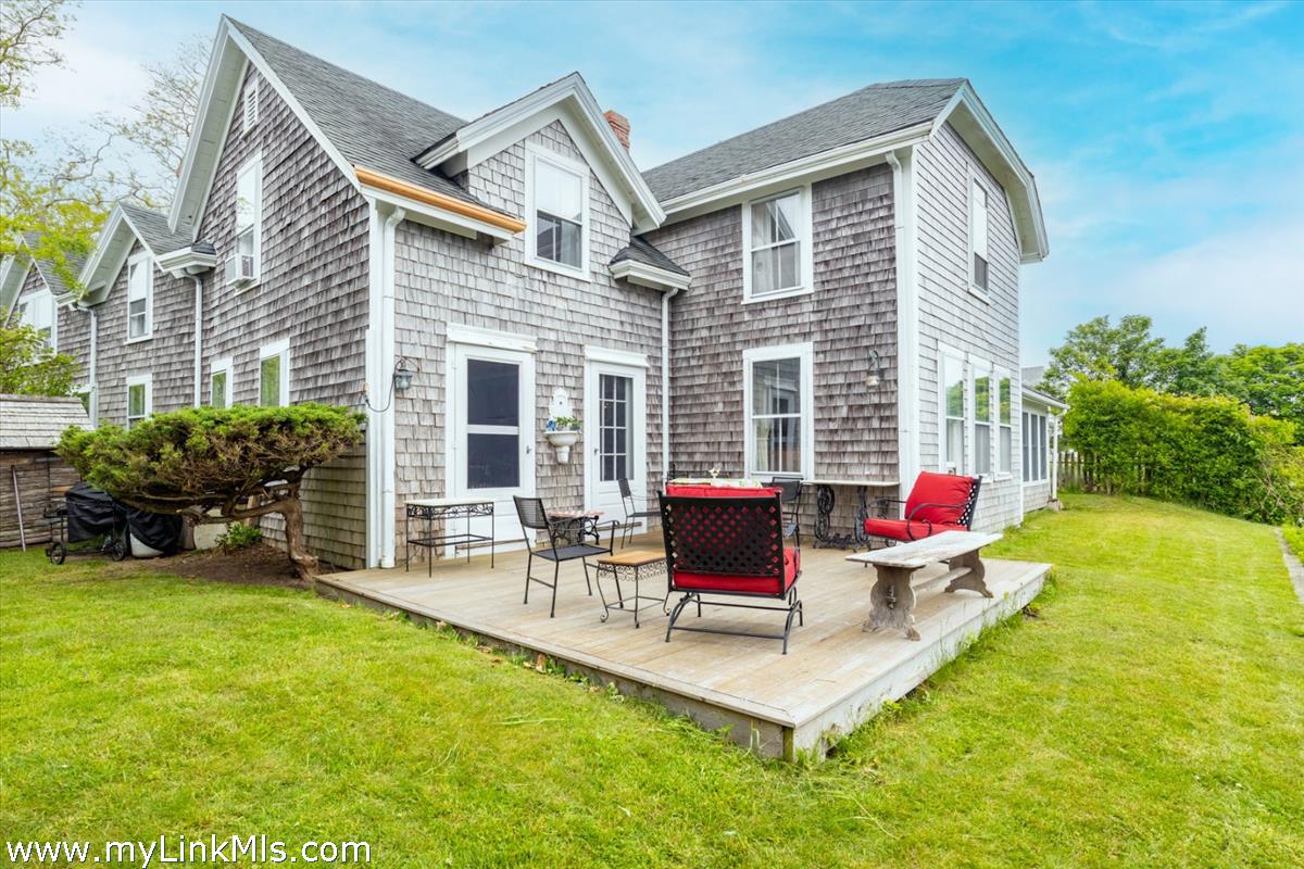 13 Cliff Road Nantucket, MA 02554 - Photo 36 of 38 a view of a house with a patio and a yard
