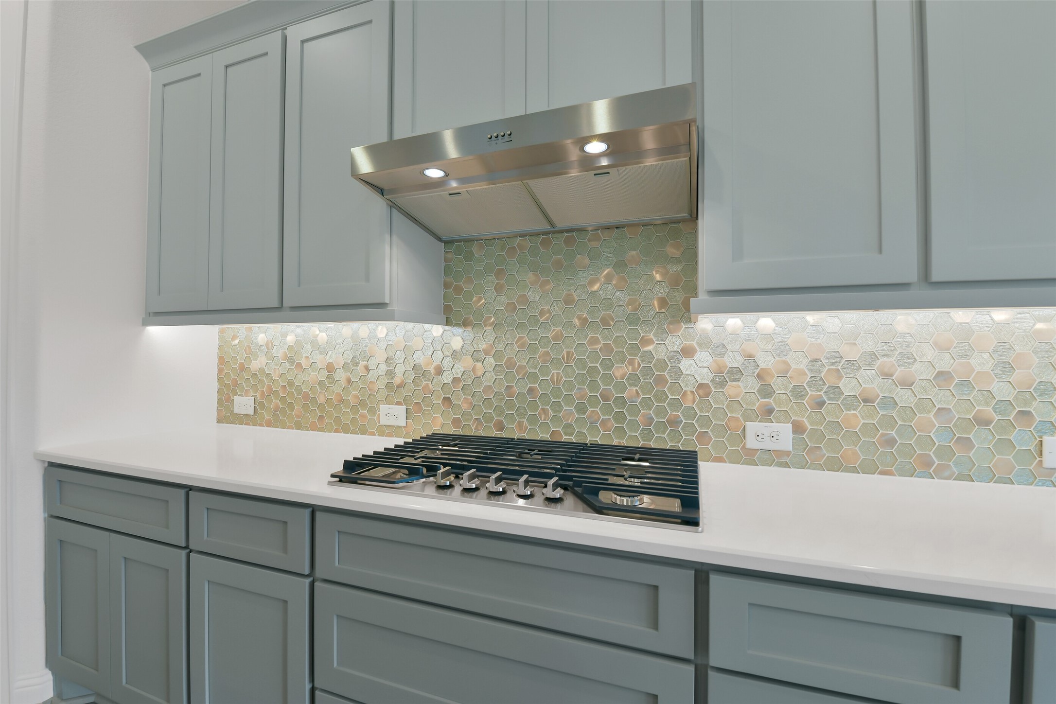 16119 Rustling Wds Road Conroe, TX 77302 - Photo 11 of 43 a kitchen with a stove and a white cabinet