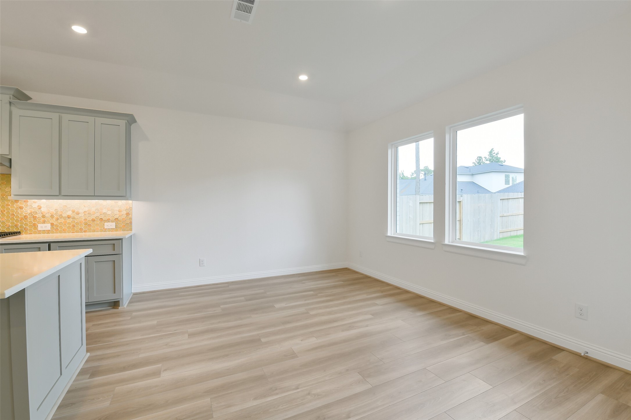 16119 Rustling Wds Road Conroe, TX 77302 - Photo 14 of 43 an empty room with wooden floor and window
