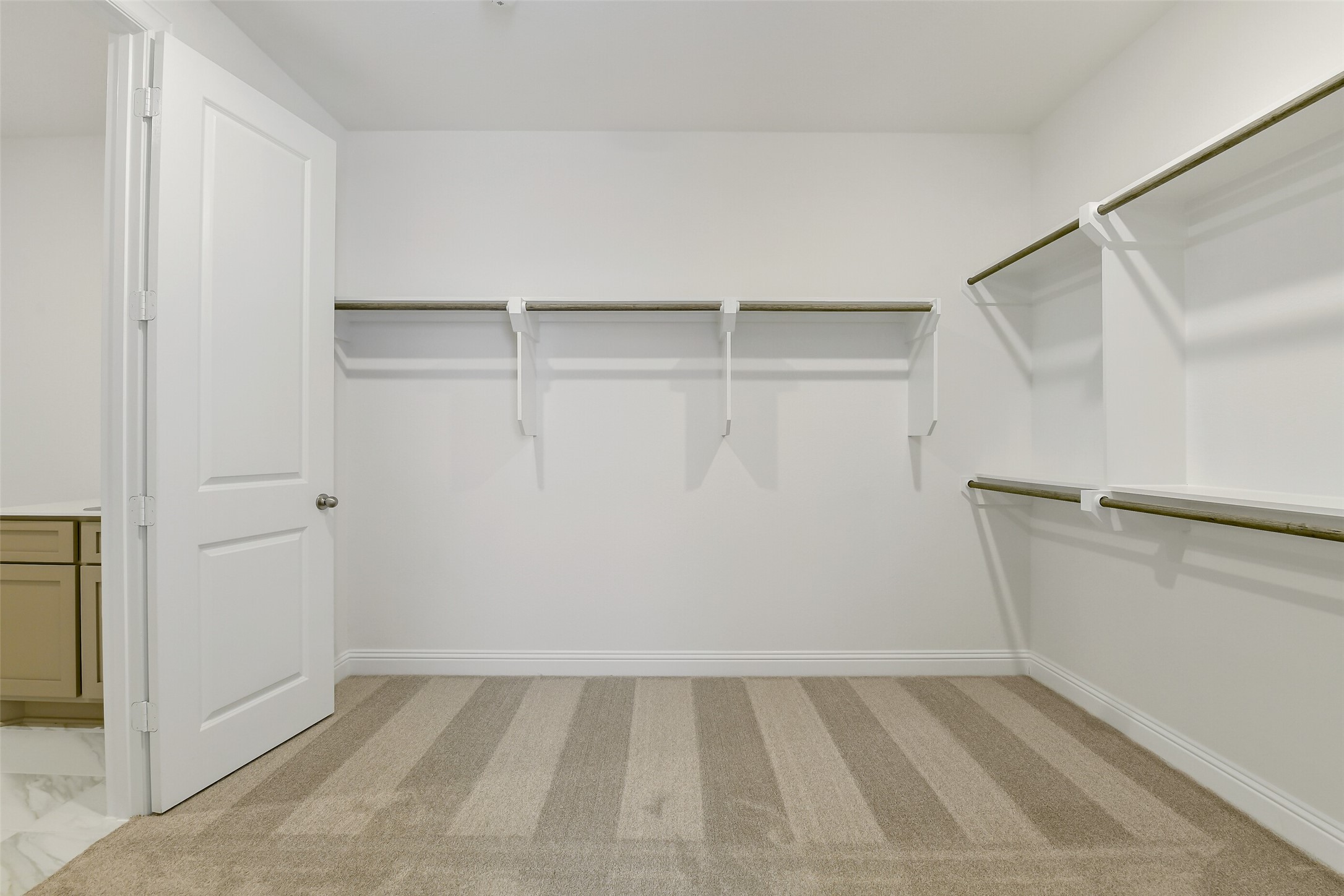 16119 Rustling Wds Road Conroe, TX 77302 - Photo 24 of 43 a view of an empty walk in closet