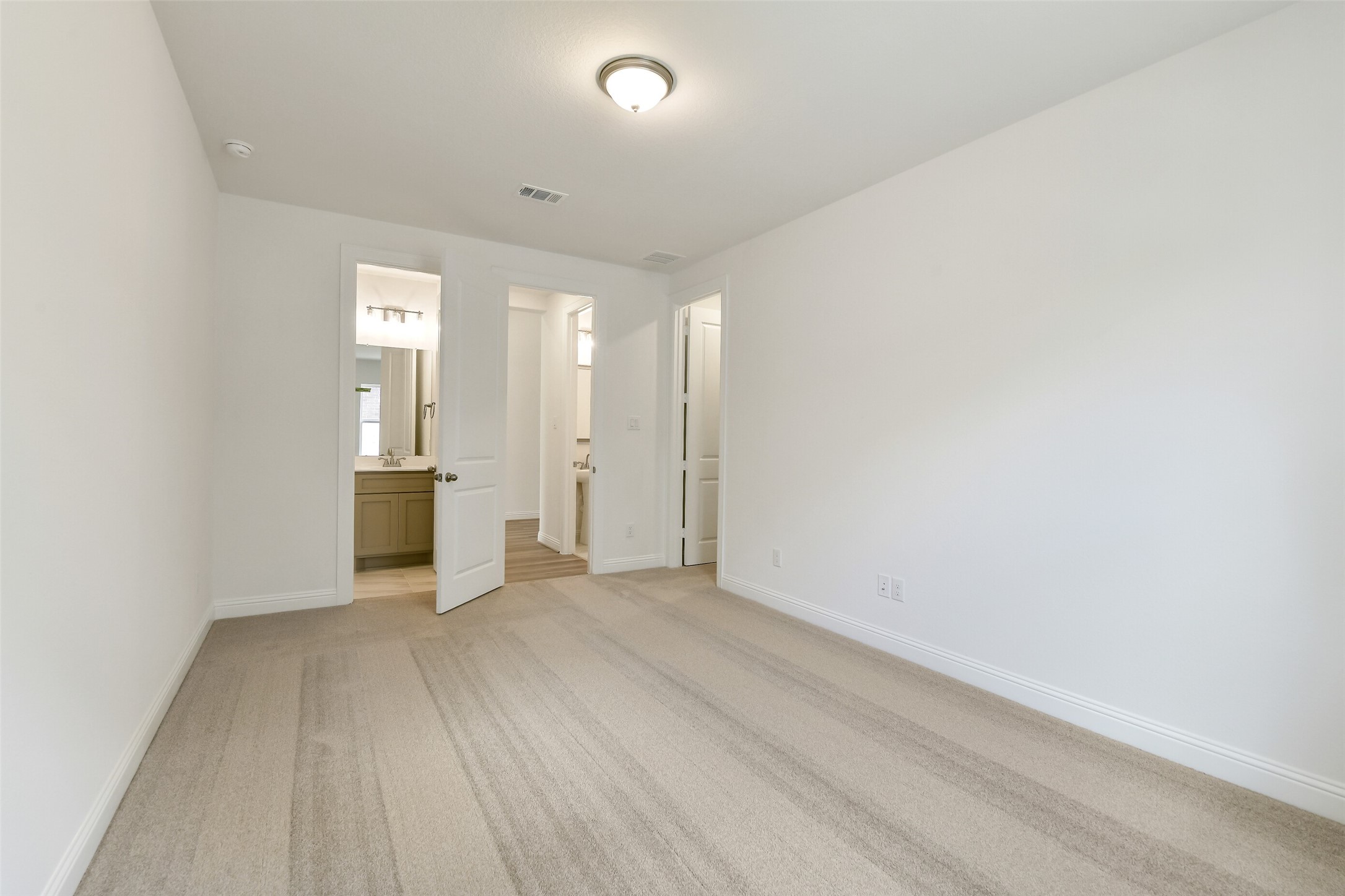 16119 Rustling Wds Road Conroe, TX 77302 - Photo 26 of 43 a view of a kitchen with a sink and a refrigerator