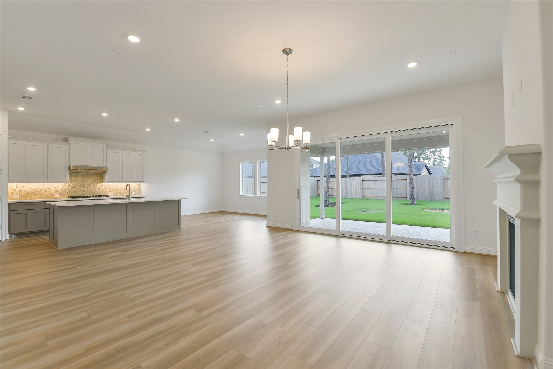 16119 Rustling Wds Road Conroe, TX 77302 - Photo 6 of 43 a view of a kitchen with a sink and a window