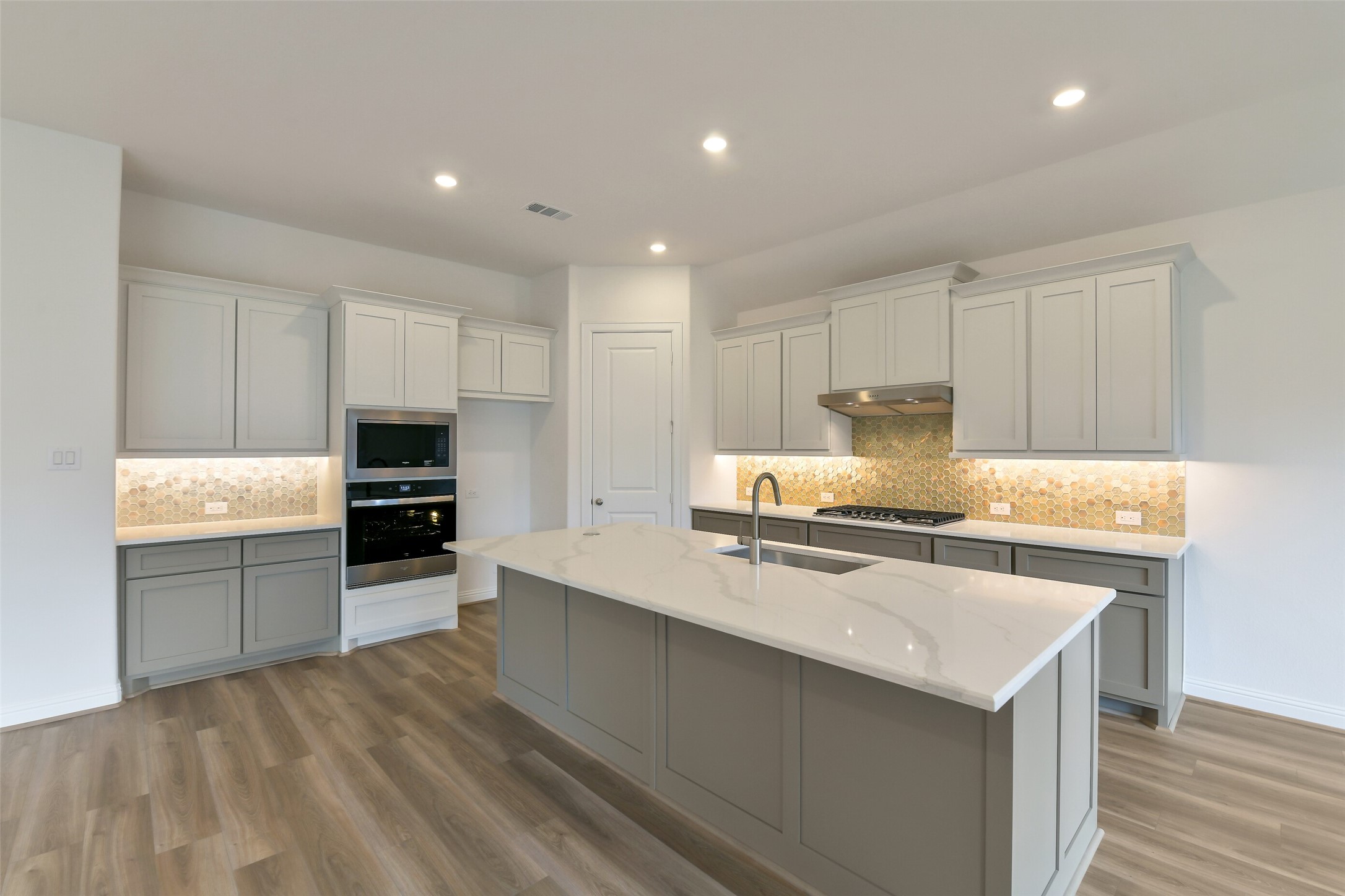 16119 Rustling Wds Road Conroe, TX 77302 - Photo 9 of 43 a kitchen with granite countertop a sink a stove and cabinets