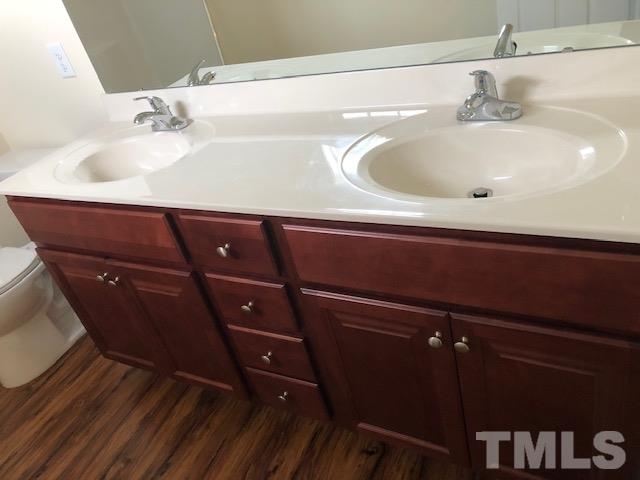 520 Branch Street Raleigh, NC 27601 - Photo 11 of 13 a bathroom with a sink and a mirror