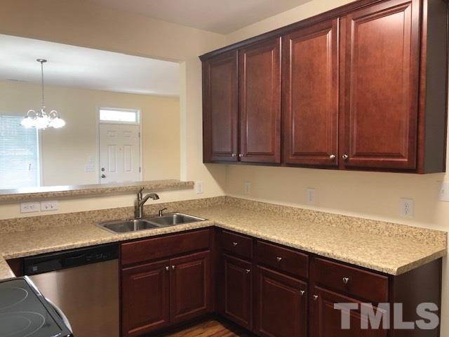 520 Branch Street Raleigh, NC 27601 - Photo 5 of 13 a kitchen with a sink and cabinets