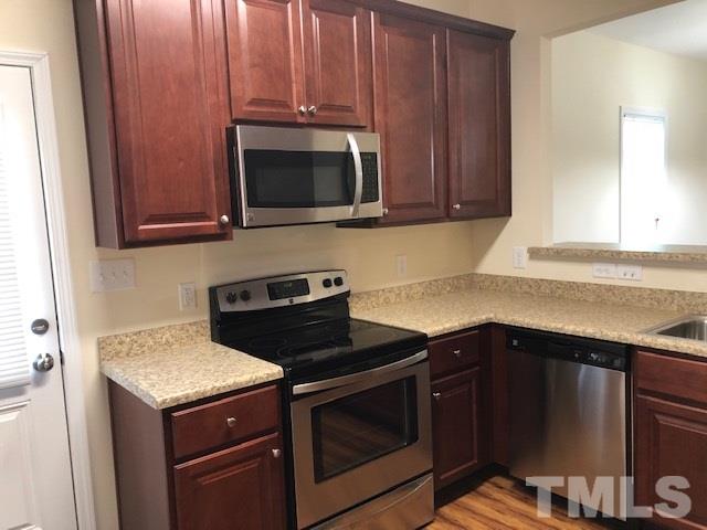 520 Branch Street Raleigh, NC 27601 - Photo 8 of 13 a kitchen with a stove microwave and sink