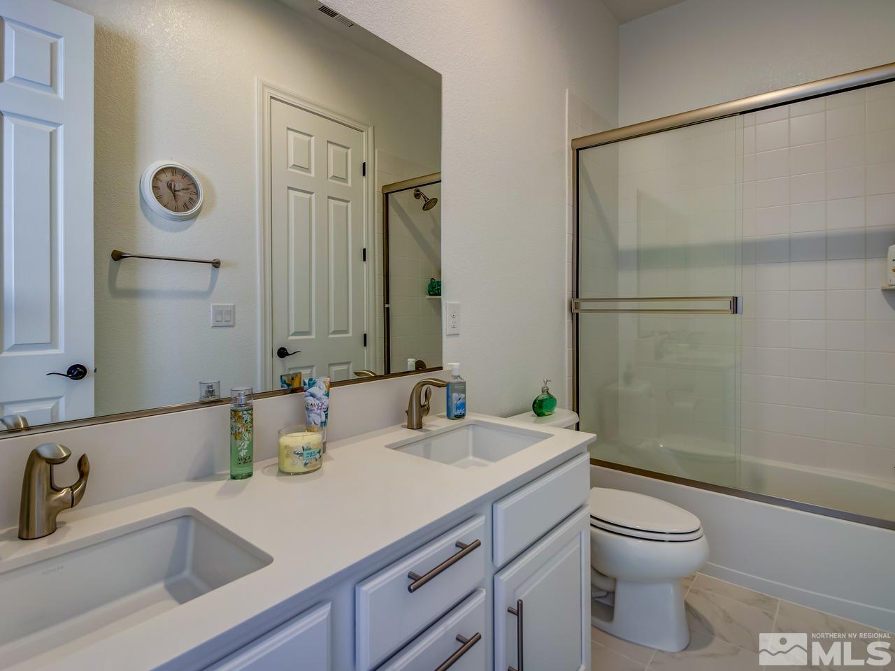 2020 Blue Boy Lane Reno, NV 89521 - Photo 15 of 20 a bathroom with a sink a toilet and shower