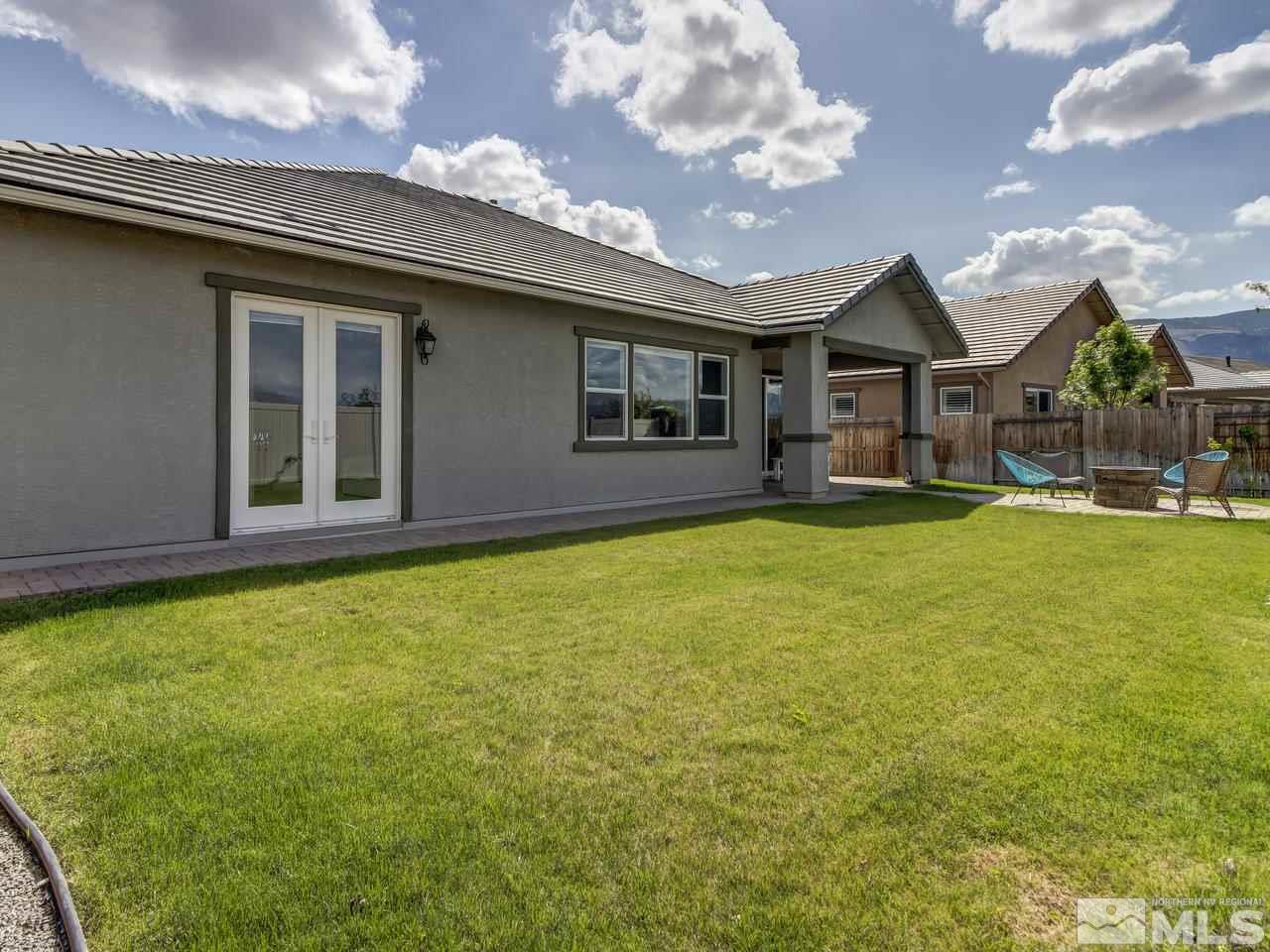 2020 Blue Boy Lane Reno, NV 89521 - Photo 19 of 20 a front view of a house with a garden and yard