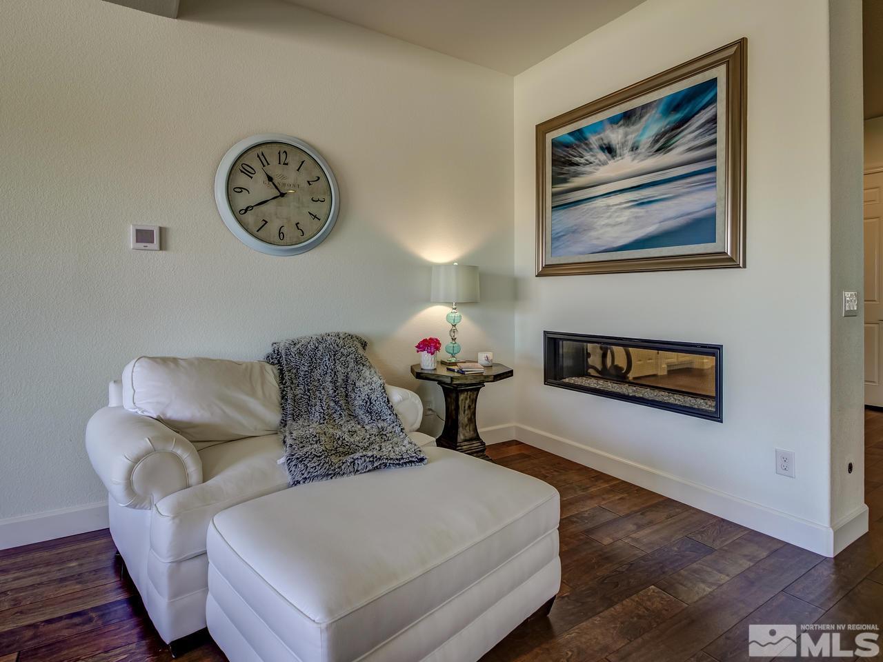 2020 Blue Boy Lane Reno, NV 89521 - Photo 6 of 20 a living room with furniture a clock and a window