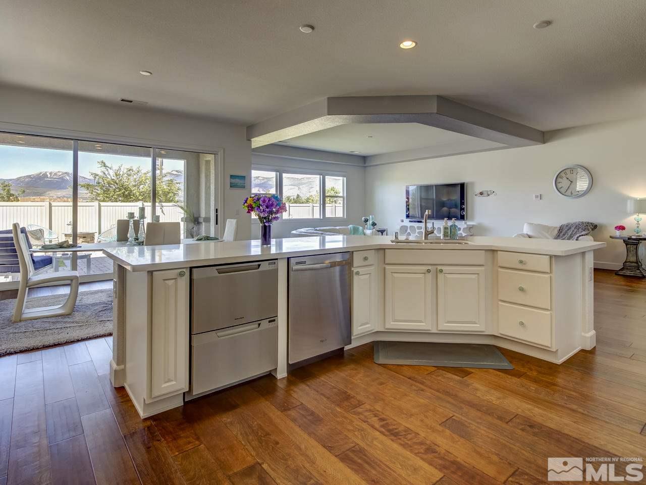 2020 Blue Boy Lane Reno, NV 89521 - Photo 8 of 20 a kitchen with a sink cabinets and wooden floor