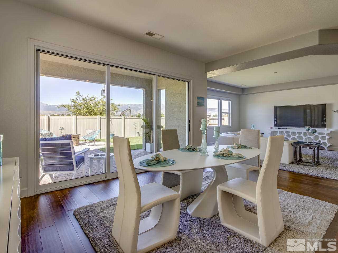 2020 Blue Boy Lane Reno, NV 89521 - Photo 9 of 20 a view of a dining room with furniture window and wooden floor