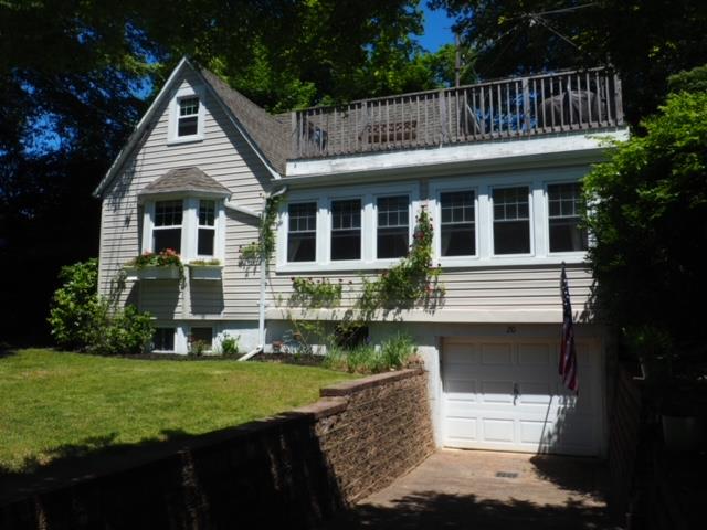 20 Locust Road Wading River, NY 11792 - Photo 1 of 1 View of front facade with a garage, balcony, driveway, and a front lawn