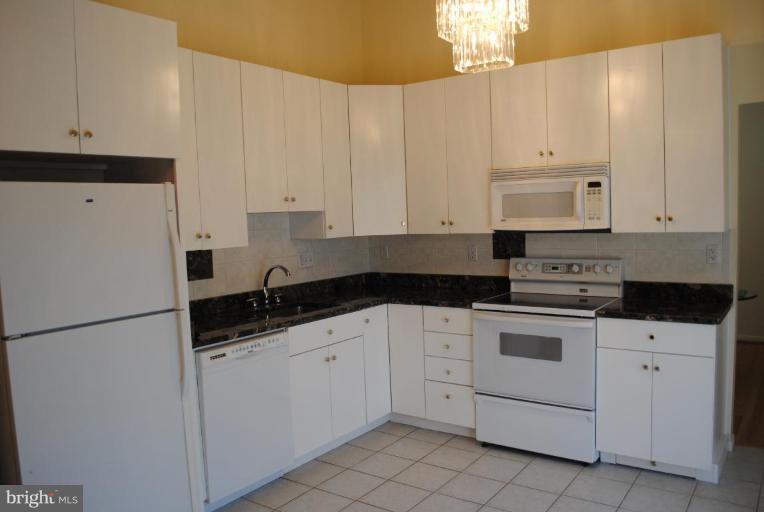 11709 Riders Lane Reston, VA 20191 - Photo 10 of 24 Remodeled Kitchen with Granite and New 42" Cabs