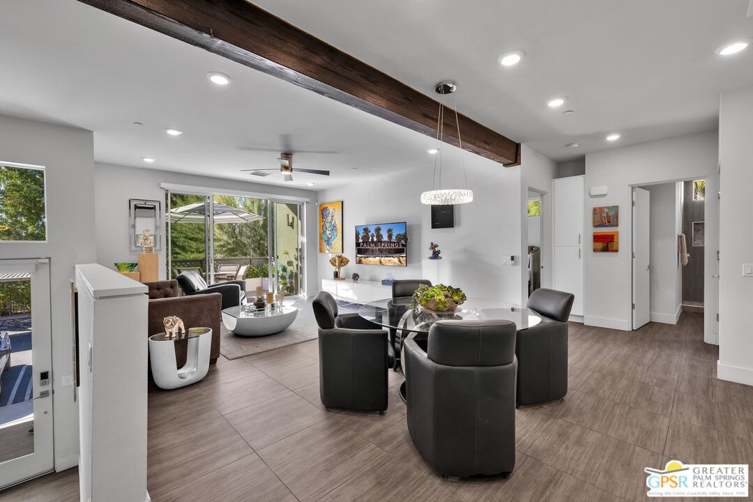 138 The River Palm Springs, CA 92262 - Photo 1 of 47 a living room with furniture a bed and a large window