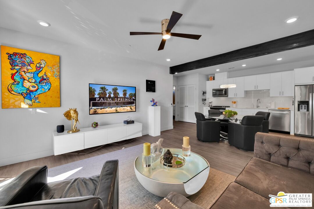 138 The River Palm Springs, CA 92262 - Photo 11 of 47 a living room with furniture and a flat screen tv