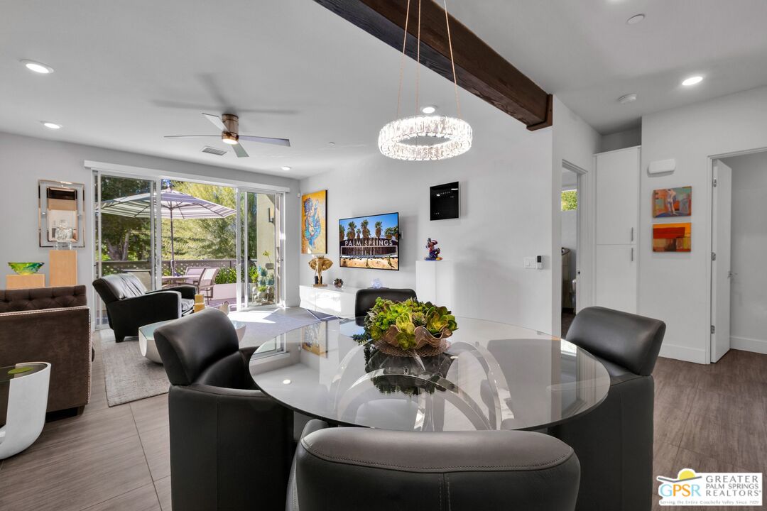 138 The River Palm Springs, CA 92262 - Photo 15 of 47 a view of a dining room with furniture wooden floor and chandelier