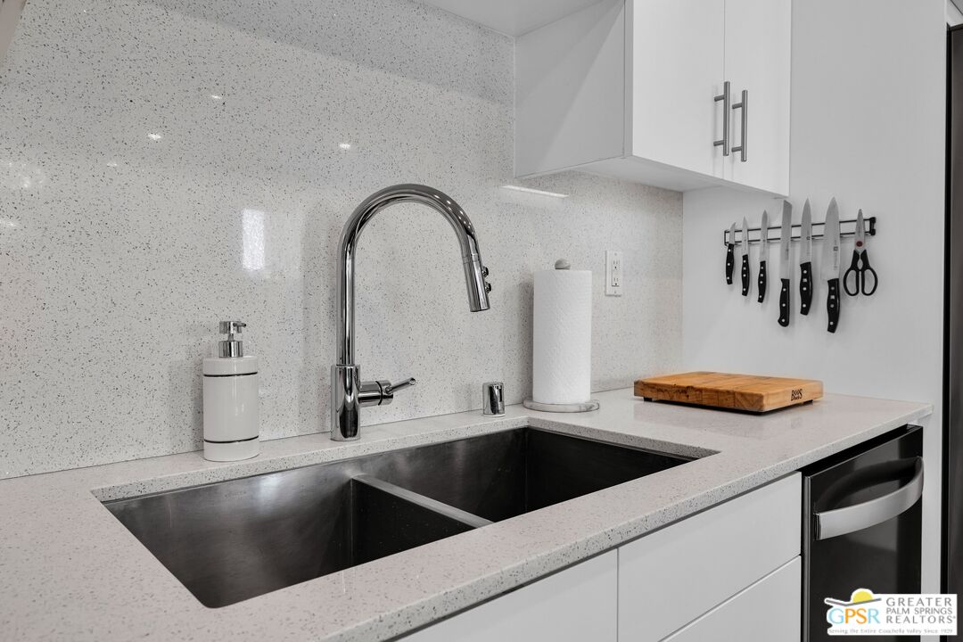 138 The River Palm Springs, CA 92262 - Photo 18 of 47 a kitchen with a sink and a stove top oven