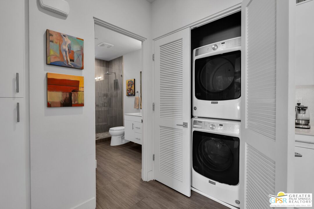 138 The River Palm Springs, CA 92262 - Photo 20 of 47 a view of a livingroom with washer and dryer