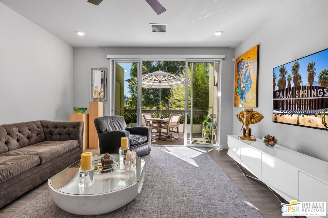 138 The River Palm Springs, CA 92262 - Photo 21 of 47 a living room with furniture and a large window