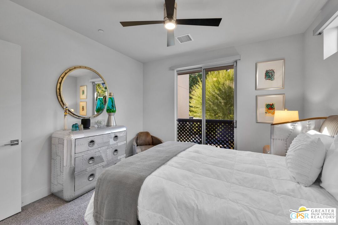 138 The River Palm Springs, CA 92262 - Photo 23 of 47 a bedroom with a bed and a dresser