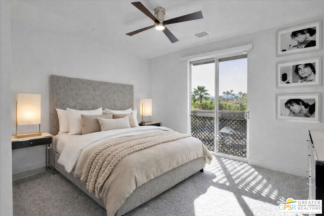 138 The River Palm Springs, CA 92262 - Photo 27 of 47 a large bed sitting in a bedroom next to a window