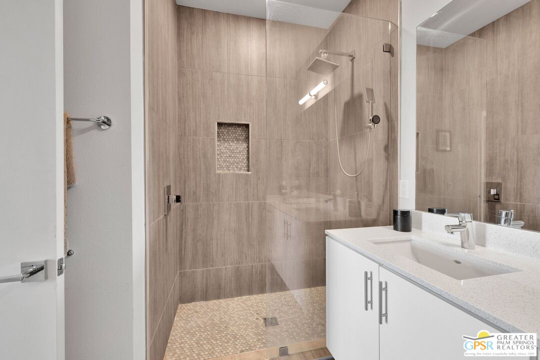 138 The River Palm Springs, CA 92262 - Photo 32 of 47 a bathroom with a sink and a mirror