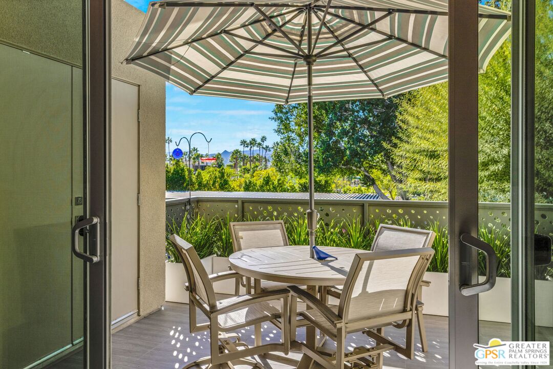 138 The River Palm Springs, CA 92262 - Photo 33 of 47 a view of a patio with a table chairs and a table