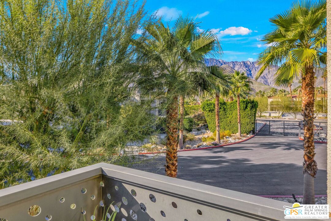 138 The River Palm Springs, CA 92262 - Photo 35 of 47 a view of a street with a tree