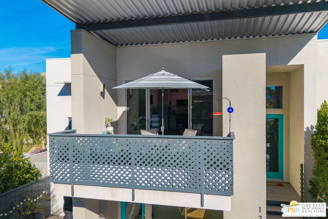 138 The River Palm Springs, CA 92262 - Photo 37 of 47 a view of a house with a balcony