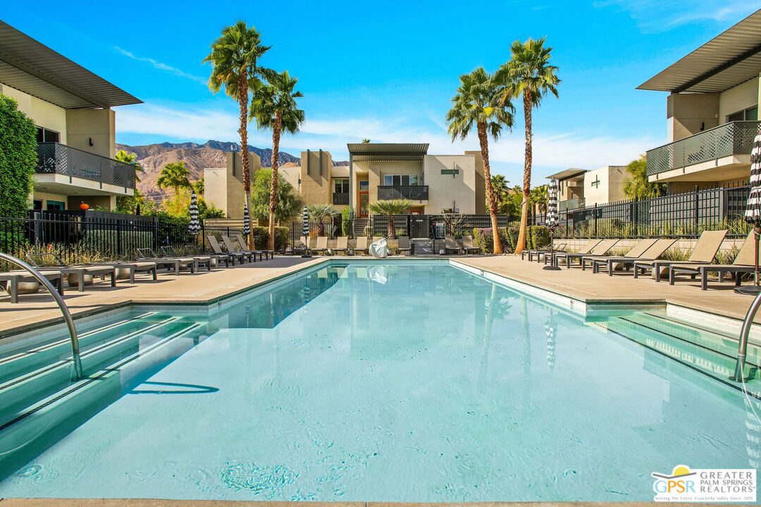 138 The River Palm Springs, CA 92262 - Photo 39 of 47 a view of a swimming pool with a patio and palm tree