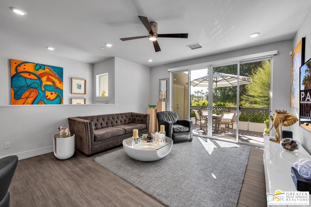138 The River Palm Springs, CA 92262 - Photo 4 of 47 a living room with furniture and a large window